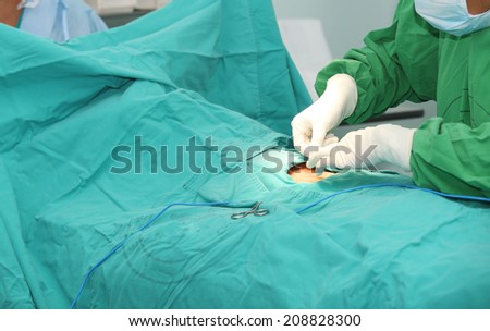 nurse getting a patch over a wound after a surgery
