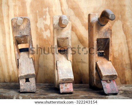 Old wood planers tools on wood background