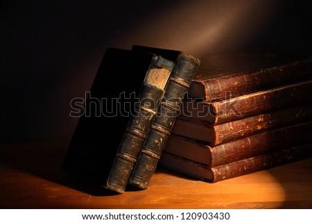 Set of very old books on dark background