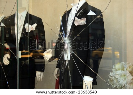 Mannequins in broken shop window