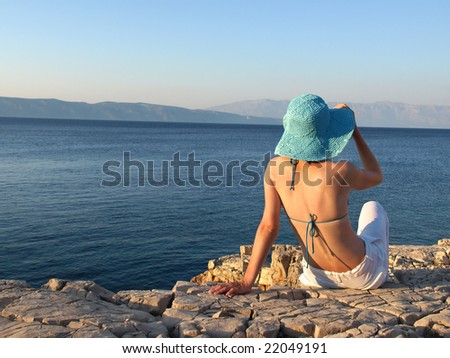 Woman taking in the beauty of the view. She is wearing linen pants and straw hat. Adriatic islands, Croatia. More like this in my portfolio!