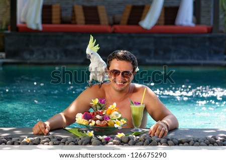 Tropical Paradise, Handsome man enjoying his dream vacations in luxury villa on Bali, Indonesia