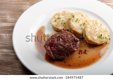 Veal fillet with rich sauce and dumplings - traditional Czech dish