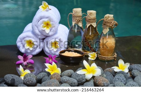 At the Spa, concept in a luxury Villa on Bali Island with, Massage oil, bath-salt, Volcanic stones, body scrub, Towels,Cinnamon sticks, Orchids and flowers.