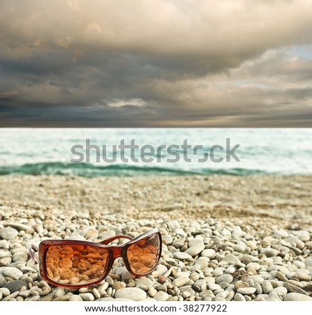 sun glasses on a seashore