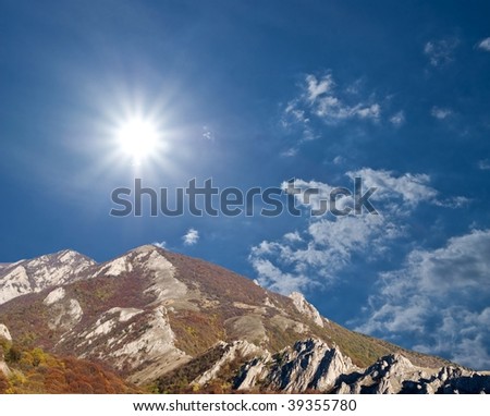 mountain chains under a sparkle sun
