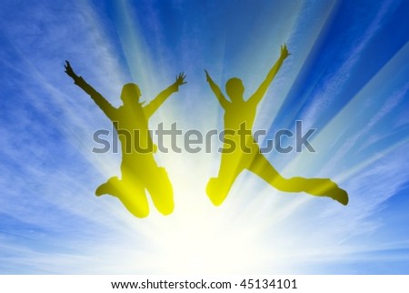 jumping peoples in a rays of sun