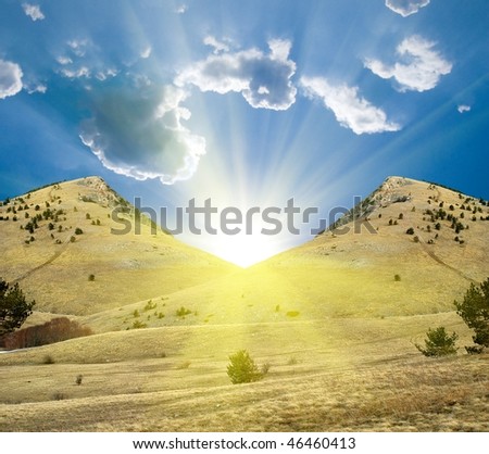 sparkle sun between two mountains