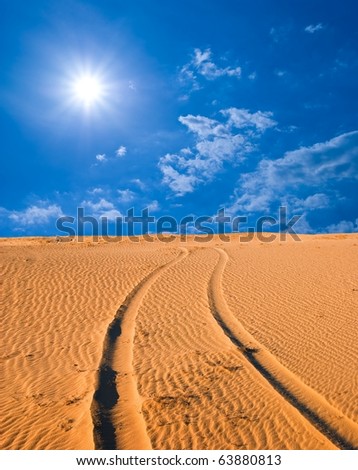road in a sand desert by a hot day