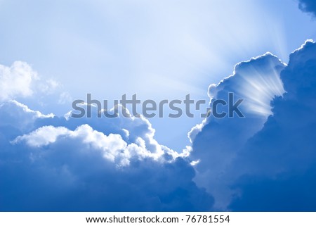 sun rays pushing through a dense clouds