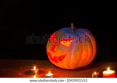 closeup halloween pumpkin with candles in dark, jack-o-lantern traditional holiday scene Foto stock © 