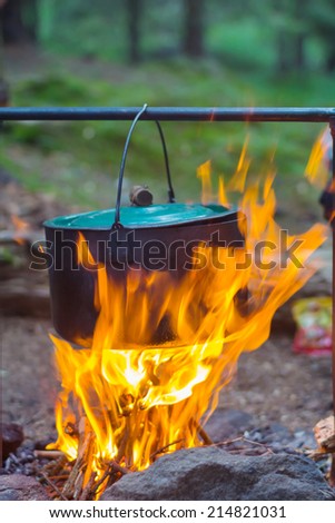 touristic cauldron in a fire
