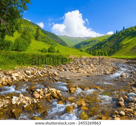 Similar – Image, Stock Photo A small river flowing through meadows and agricultural fields in April