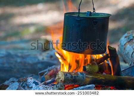 touristic cauldron on a fire