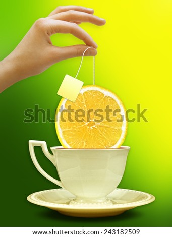 A cup of tea with a slice of lemon. Background for poster or advertising. Photo montage concept. High Quality.