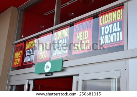Signs in front of closing store