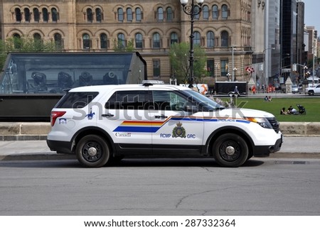Ottawa, Canada - May 24, 2015: RCMP police is seen patrolling the Parliament Hills ground.