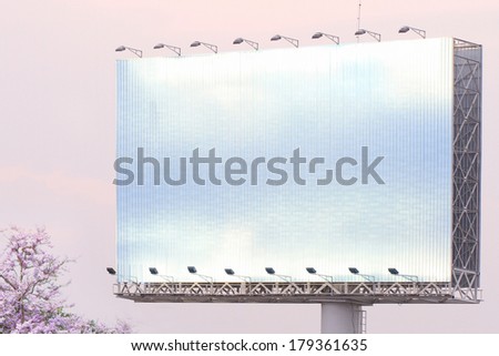 blank white billboard on the edge of country road sunset sky with spot light.