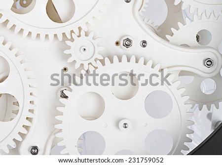 White color Plastic idle gear Photo fragment of machine. The gears meshing together(teamwork concept) .