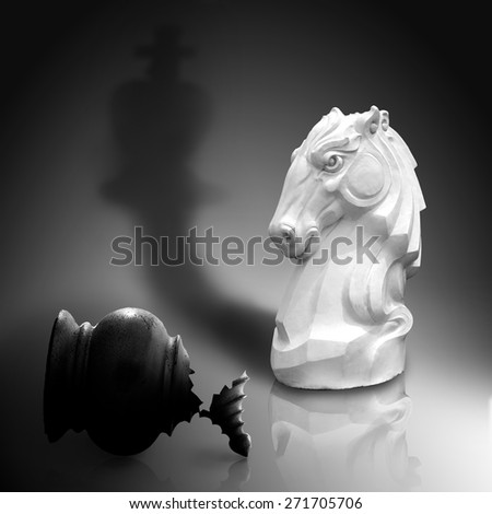 The white knight strong checkers who brought victory to defeat the enemies, Isolated on dark gray background with clipping path. Concept of Strategic Planning to the success of management or business.