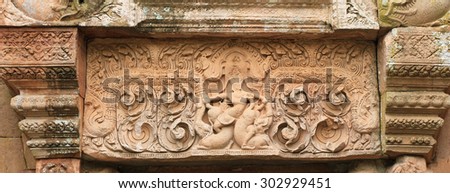 Art sandstone carvings in the ancient ornamental pediment above the entrance to the castle. Prasat Hin Phanom rung  Historical Park, sand stone castle in Buriram, Thailand.