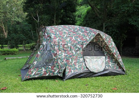 Tent While in striped green forest