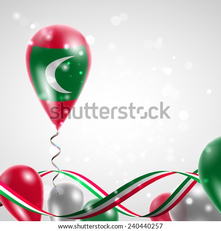 Flag of the Maldives on balloon. Celebration and gifts. Ribbon in the colors are twisted. Balloons on the feast of the national day. 