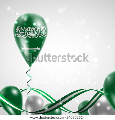 Flag of Saudi Arabia on balloon. Celebration and gifts. Ribbon in the colors are twisted. Balloons on the feast of the national day. 