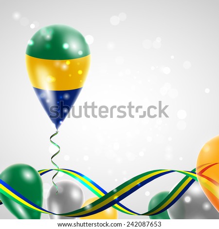 Flag of Gabon on balloon. Celebration and gifts. Ribbon in the colors are twisted. Balloons on the feast of the national day. 