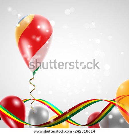 Flag of Seychelles on balloon. Celebration and gifts. Ribbon in the colors are twisted. Balloons on the feast of the national day. 