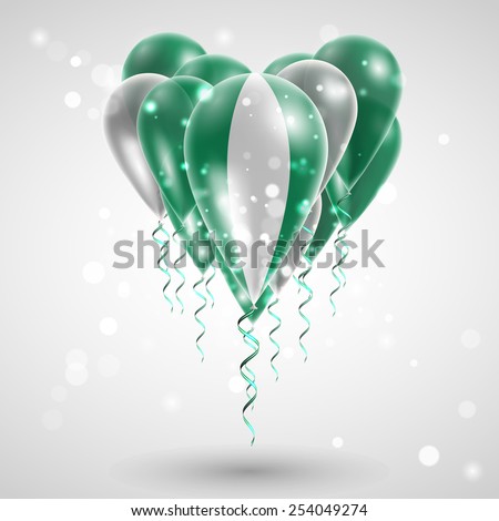 Flag of Nigeria on air balls in heart-shaped. Celebration and gifts. Ribbon in the colors are twisted under the balloon. Independence Day. Balloons on the feast of the national