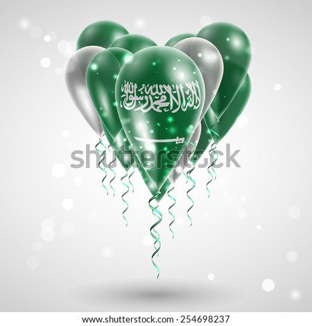 Flag of Saudi Arabia on air balls in heart-shaped. Celebration and gifts. Ribbon in the colors are twisted under the balloon. Independence Day. Balloons on the feast of the national