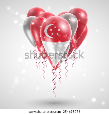 Flag of Singapore on air balls in heart-shaped. Celebration and gifts. Ribbon in the colors are twisted under the balloon. Independence Day. Balloons on the feast of the national