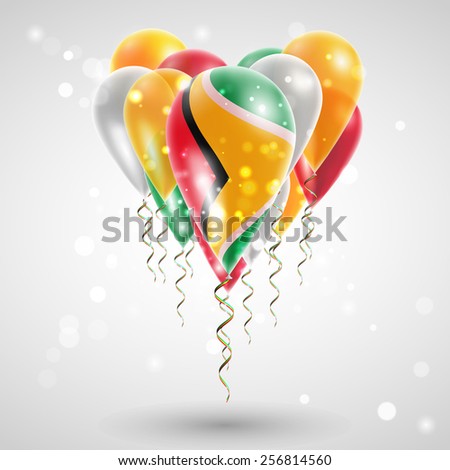 Flag of Guyana on air balls in heart-shaped. Celebration and gifts. Ribbon in the colors are twisted under the balloon. Independence Day. Balloons on the feast of the national