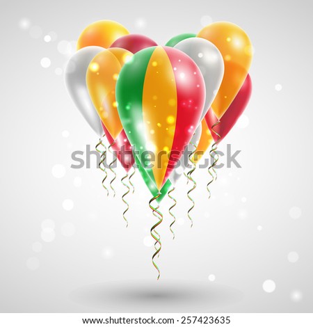 Flag of Mali on air balls in heart-shaped. Celebration and gifts. Ribbon in the colors are twisted under the balloon. Independence Day. Balloons on feast of the national