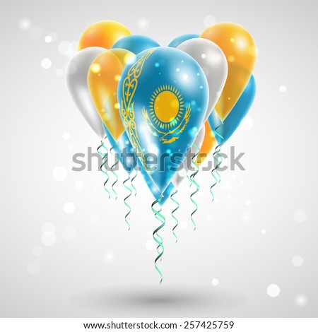 Flag of Kazakhstan on air balls in heart-shaped. Celebration and gifts. Ribbon in  colors are twisted under the balloon. Independence Day. Balloons on the feast of the national