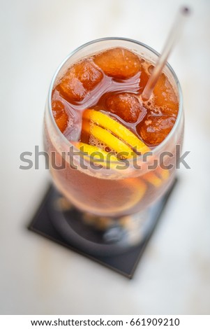 ice lemon tea in a atall glass with three lemon slices Stok fotoğraf © 
