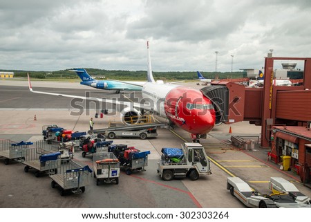 STOCKHOLM AIRPORT, SWEDEN - 22 JULY 2015: Norwegian plane  on the base on Stockholm Arlanda Airport. Norwegian operates over 100 aircraft and is one of the biggest low-cost airline company in Europe.