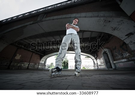 Wide angle photo of a rollerskater in urban scenery