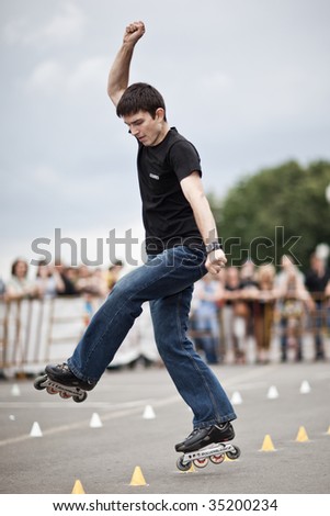 MOSCOW - JULY 25 : Dmitry Korotkih (Russia) performs one wheel spin element at Luzhniki Olympic Arena during Russian Rollerskating Federation Championship July 25, 2009 in Moscow.