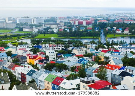 Beautiful super wide-angle aerial view of Reykjavik, Iceland with harbor and skyline  and scenery beyond the city, seen from the observation tower of Hallgrimskirkja Cathedral.
