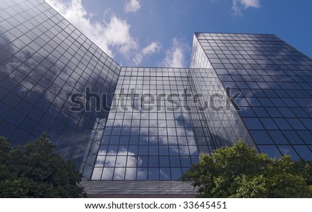 View of glass panes and reflection from street level looking up.