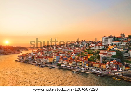 Magnificent sunset over the Porto city center and the Douro river, Portugal. Dom Luis I Bridge is a popular tourist spot as it offers such a beautiful view over the area.  Stock foto © 