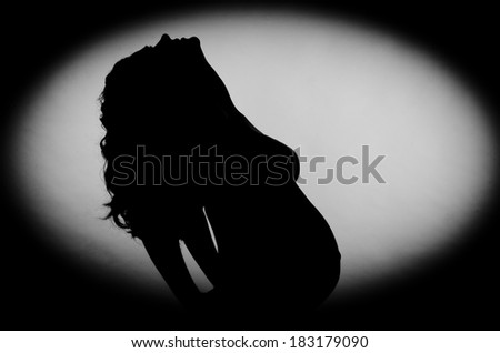 Pregnant woman in the dark