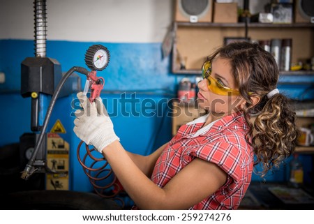 Female mechanic at work. auto service station, working girl. woman working in the garage