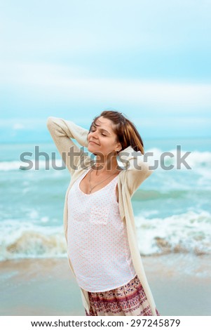 girl on the beach, happy and free, relaxation and freedom. Relax on the beach