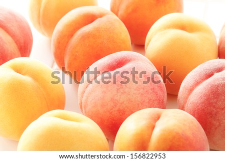 Shot in white back a ripe peach of high-grade wide