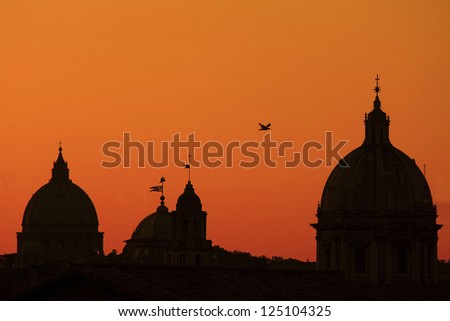 silhouette of churces in Rome at sunset