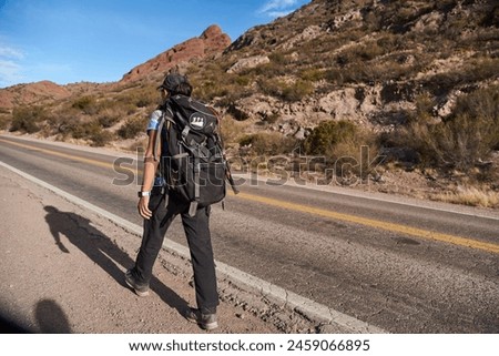 Similar – Foto Bild Frau mit Rucksack geht auf Felsen am Bach im Wald