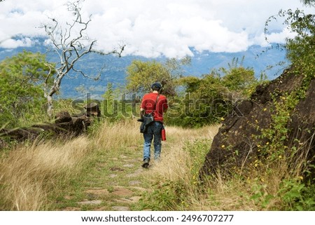 Similar – Image, Stock Photo Unrecognizable man on stone near lighthouse